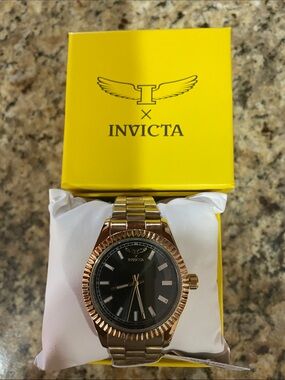 Invicta Men’s Gold Tone Bracelet and Black Dial Watch